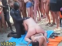 Interracial swinger threesome in public on the crowded beach